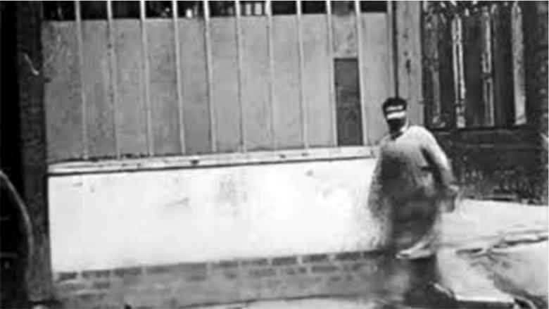 Man Walking Around a Corner still 1